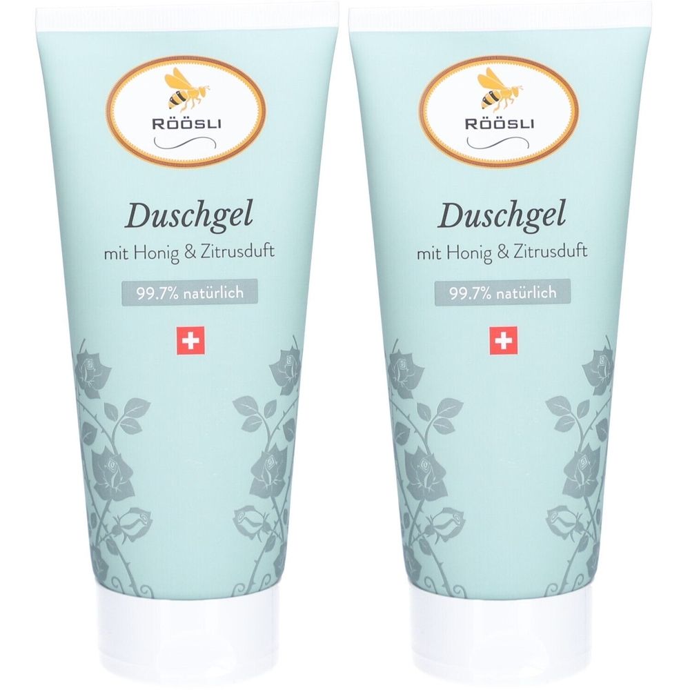 Deux tubes de gel douche bleu clair, motif floral. Logo avec abeille et texte RÖÖSLI. Texte : Duschgel, miel & agrumes, 99,7% naturel, croix suisse.