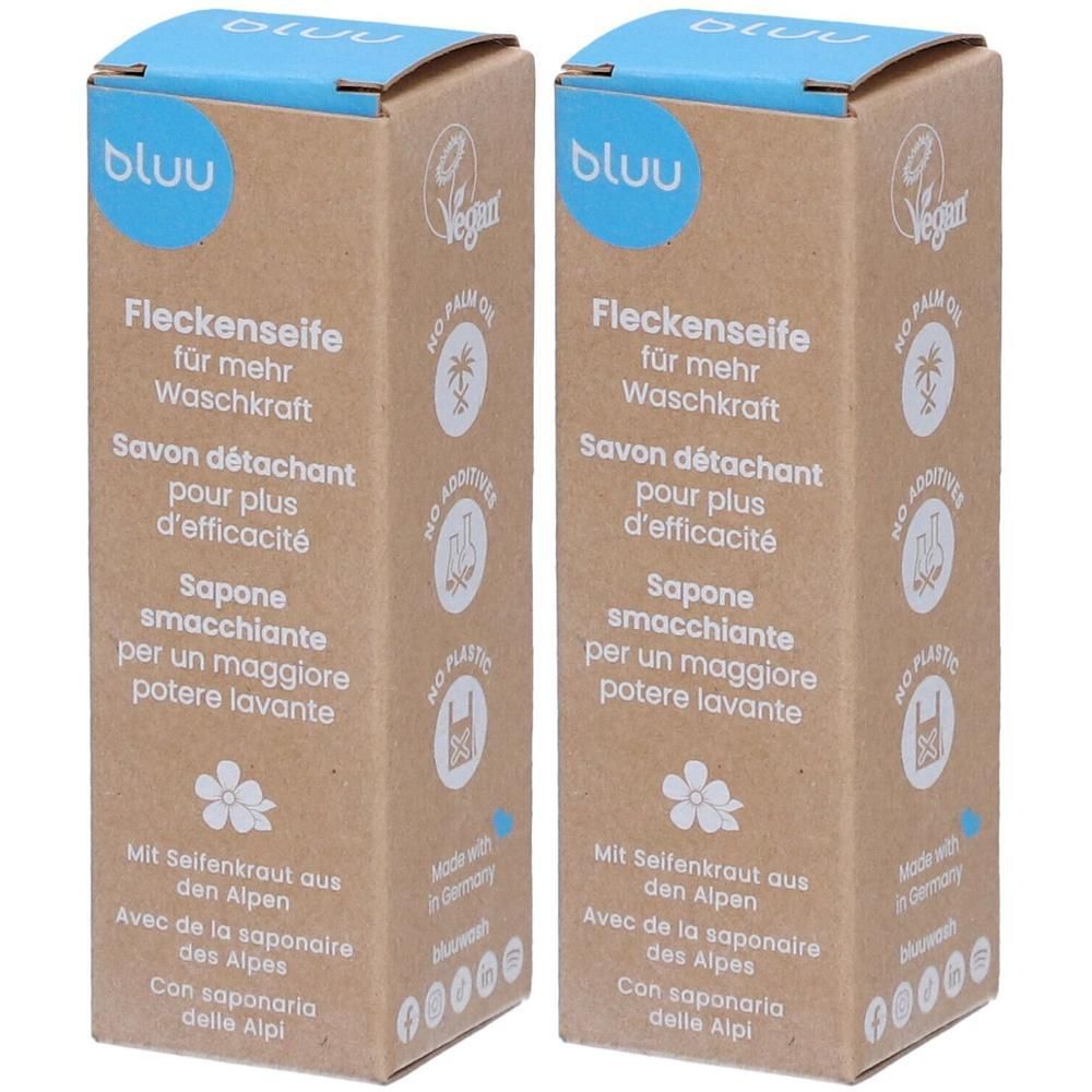 Deux boîtes rectangulaires en carton. Inscription : "bluu Fleckenseife für mehr Waschkraft". Label vegan, sans huile de palme, sans additifs, sans plastique.
