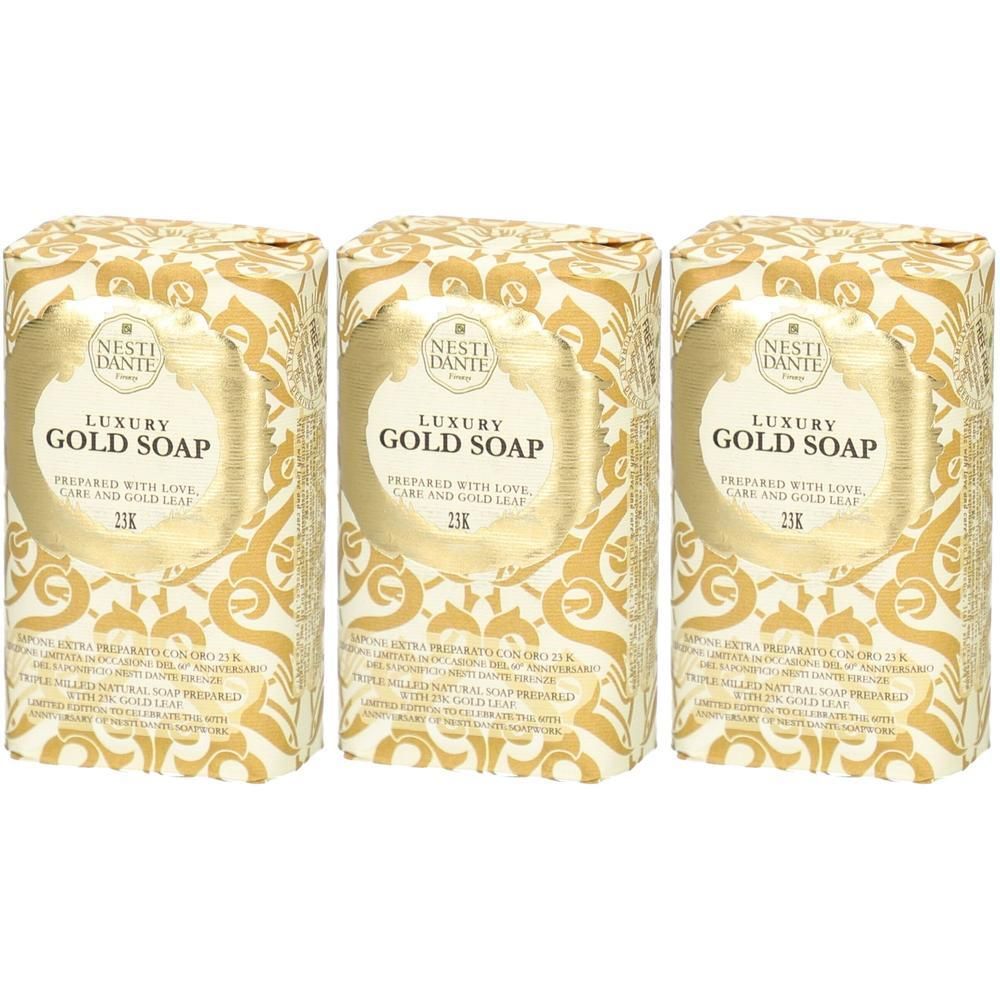 Drie pakken NESTI DANTE Luxus Gold Soap met 24K bladgoud. Goudkleurig patroon op witte achtergrond.