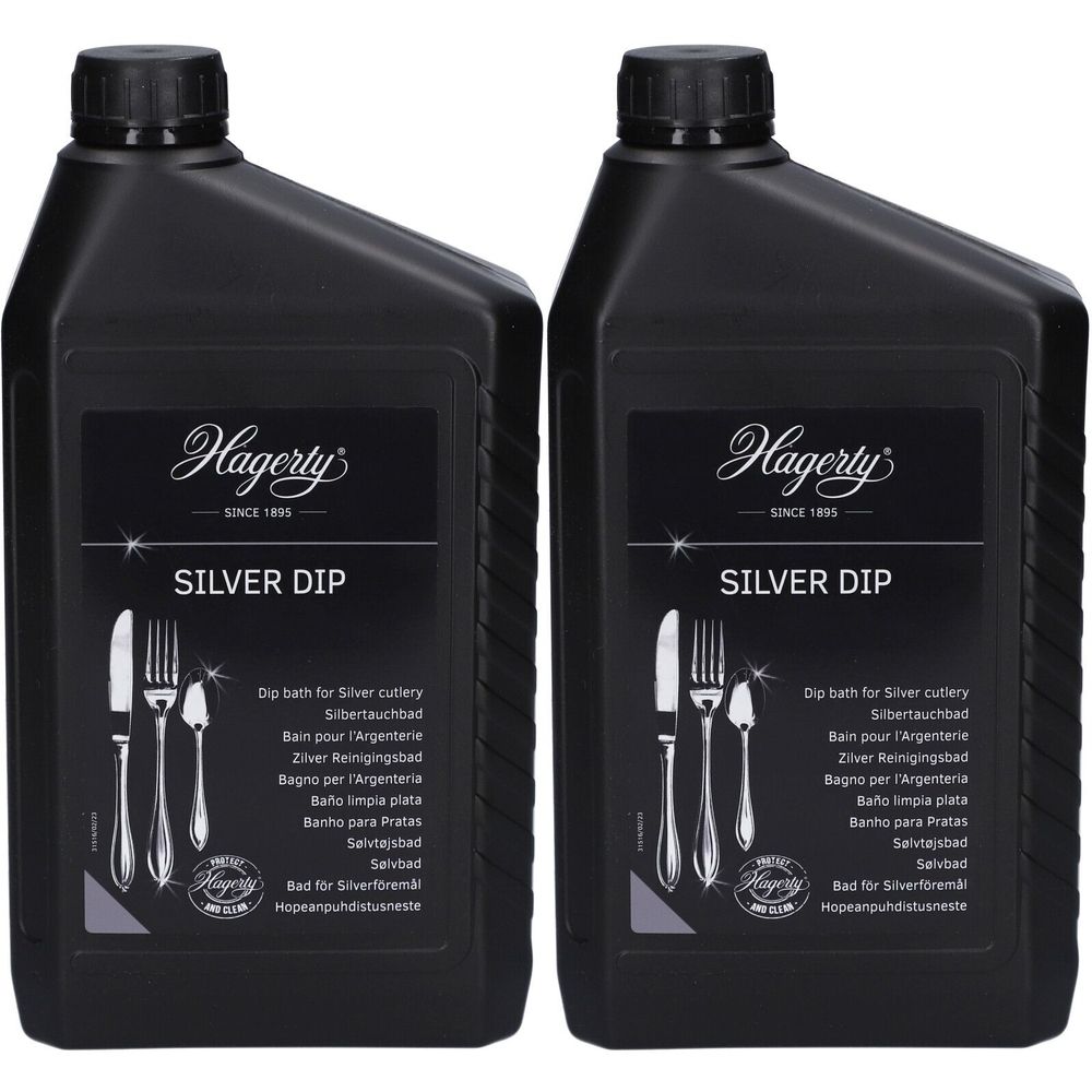 Twee zwarte flessen met het etiket "Hagerty Silver Dip". Het etiket toont bestekillustraties en productnamen in meerdere talen.