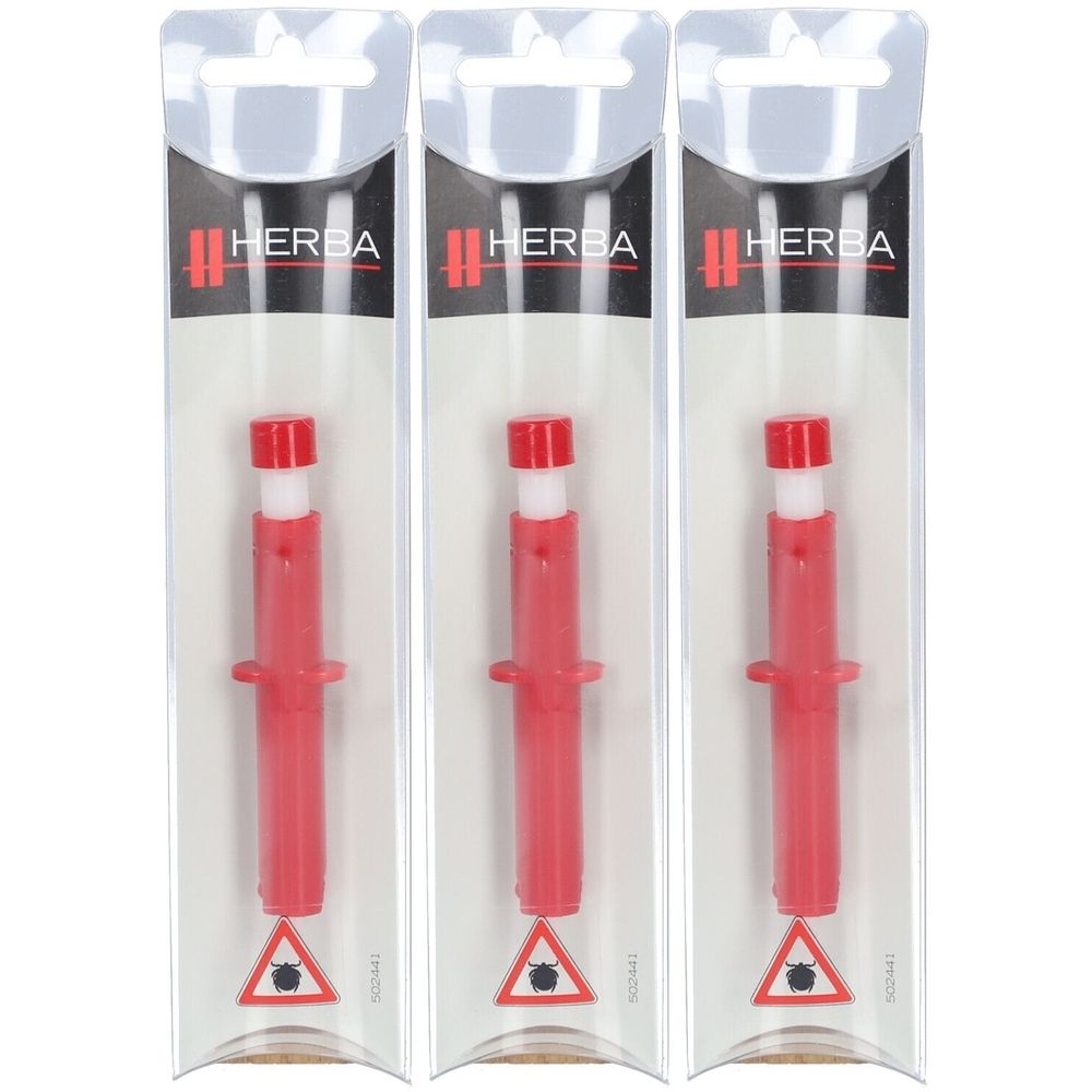 Drie rode tekenpincetten in blisterverpakking. Opschrift HERBA. Waarschuwing met teek.
