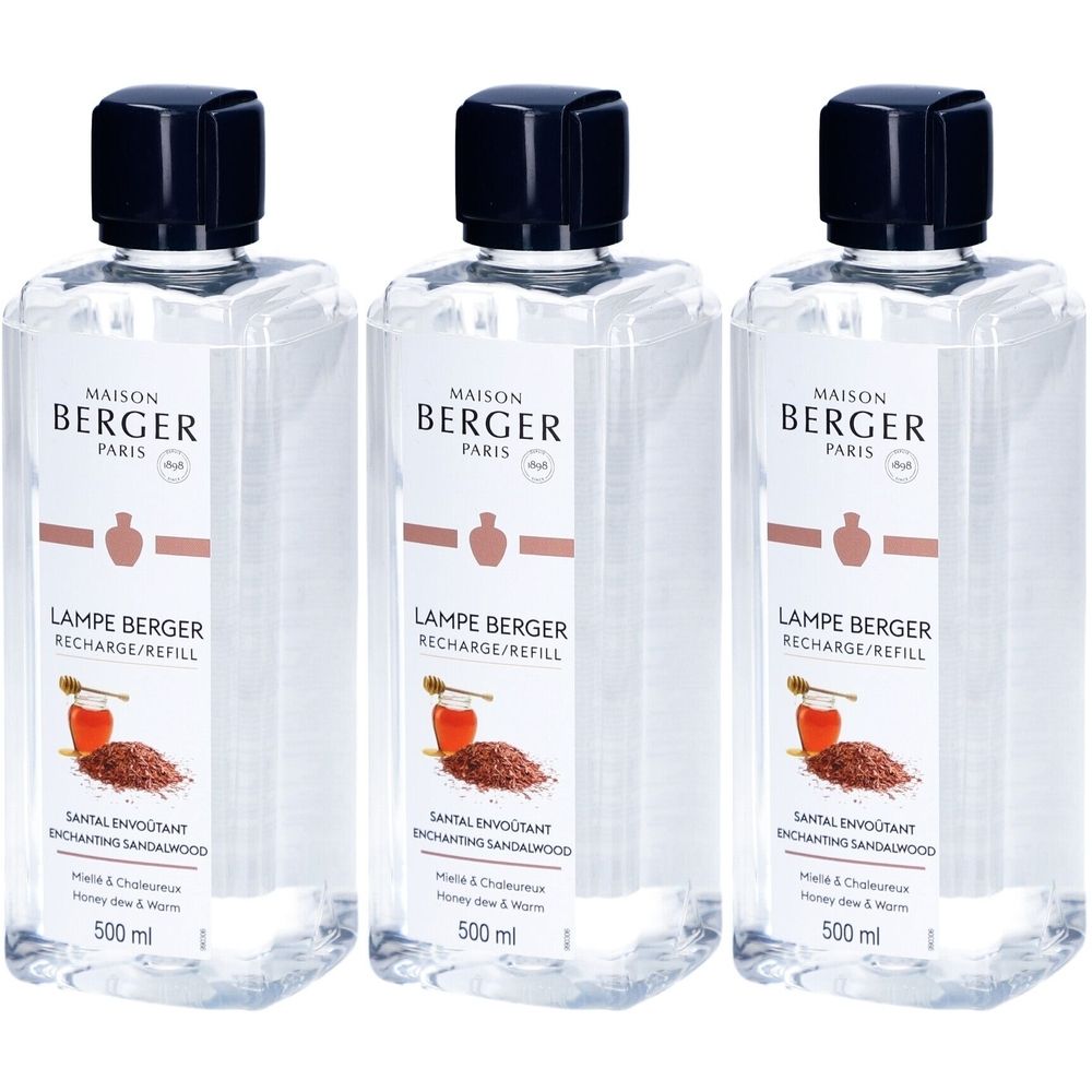 Trois flacons de recharge Lampe Berger Paris. Liquide clair, bouchon noir, étiquette blanche avec informations produit.