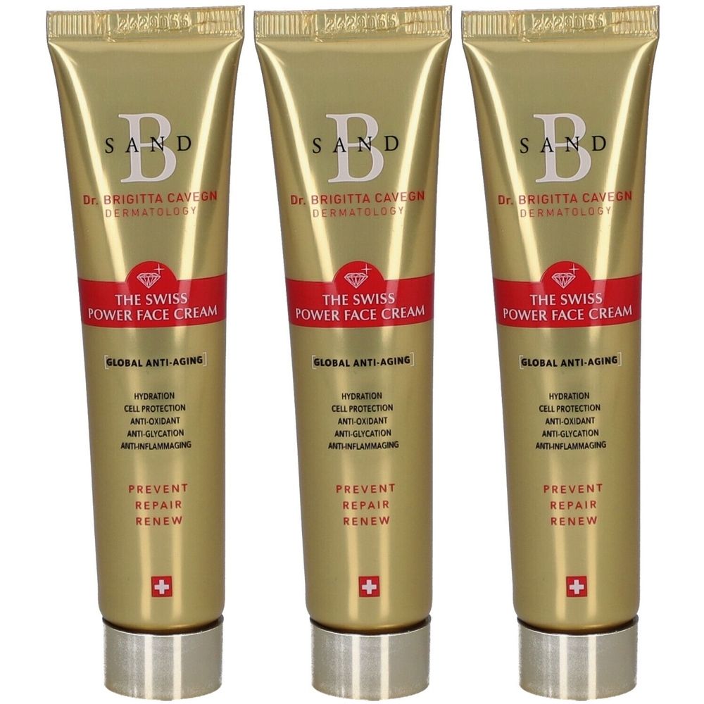 Drie goudkleurige tubes met rode band. Opschrift: SAND, Dr. Brigitta Cavegn, THE SWISS POWER FACE CREAM, Global Anti-Aging.