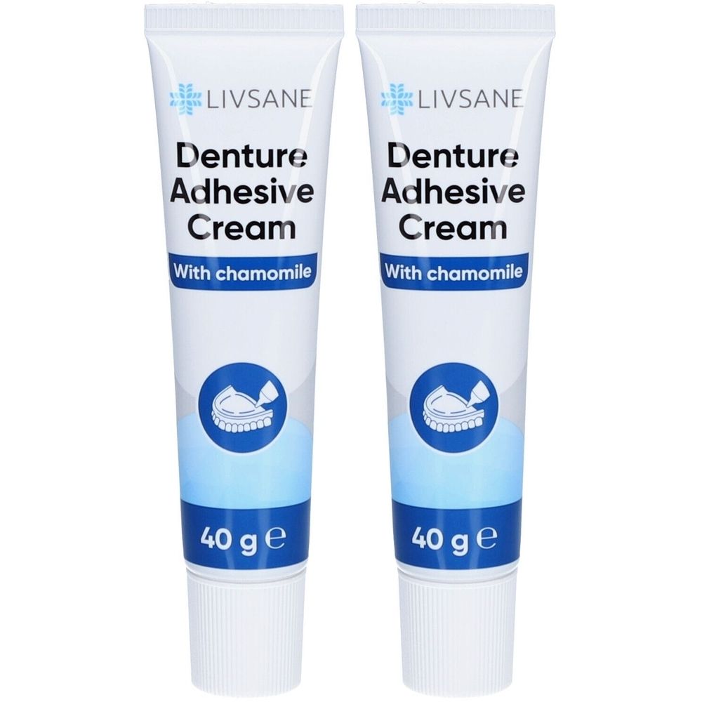 Deux tubes de crème adhésive pour prothèses Livsane à la camomille. Inscription : Denture Adhesive Cream, 40 g. Logo dentier.