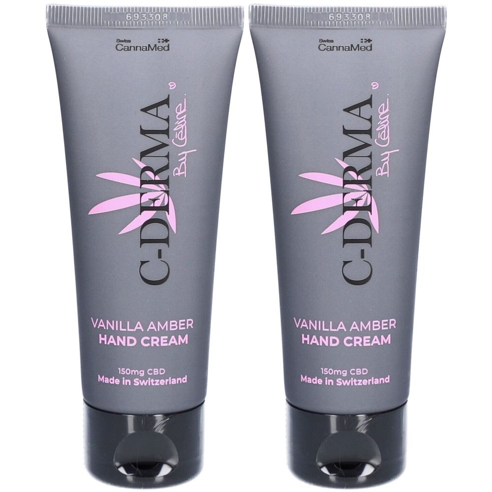 Deux tubes de crème pour les mains C-DERMA. Tubes gris avec logo rose et texte. Contient 150mg de CBD. Fabriqué en Suisse.