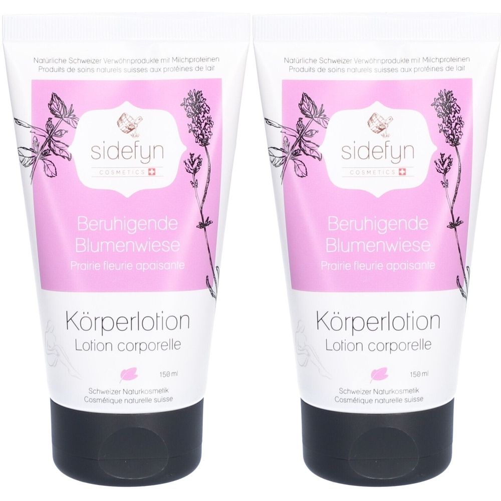 Twee tubes bodylotion. Witte tubes met roze etiket, bloemmotief en tekst. Zwarte schroefdop. Tekst: Beruhigende Blumenwiese.