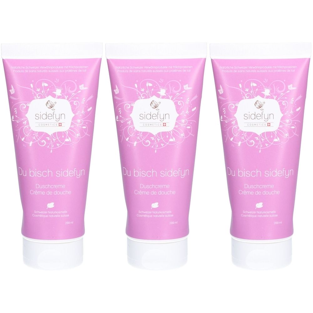 Drie roze tubes douchecrème met witte opdruk. Opschriften: sidefyn, Du bisch sidefyn, Duschcreme, Crème de douche.
