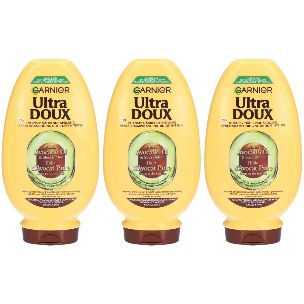 Drie gele flessen. Op elk staat "GARNIER Ultra DOUX" en "Avocat Pure".