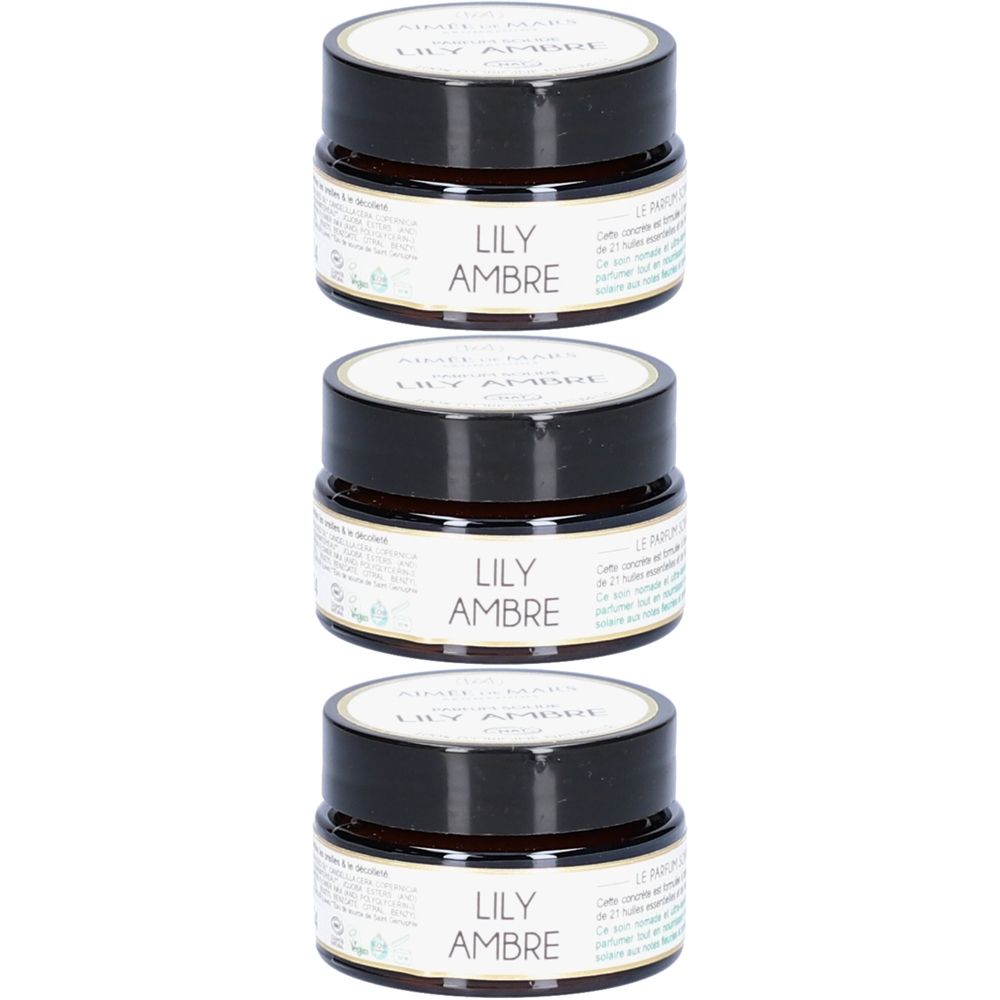 Drie kleine, ronde potjes met zwarte deksels. Op het etiket staat "LILY AMBRE".