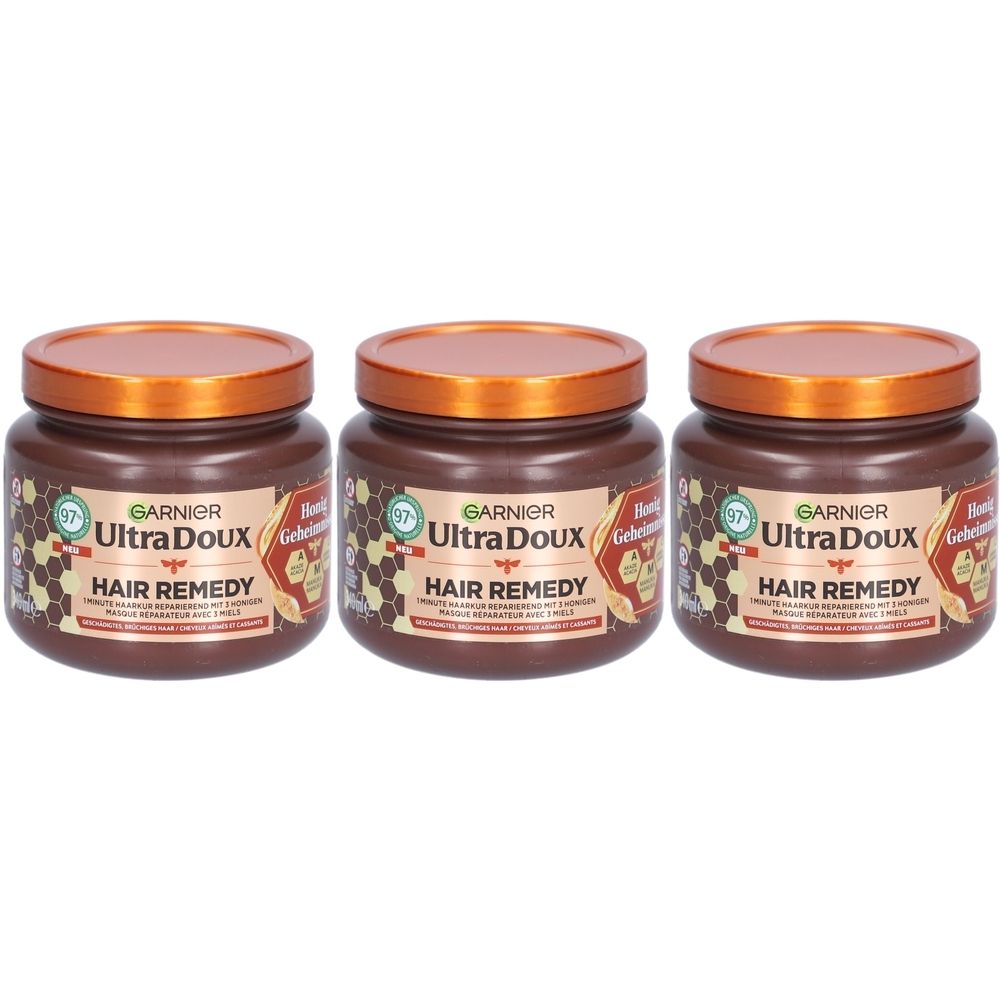 Trois pots de soin capillaire Garnier Ultra Doux avec motif miel.