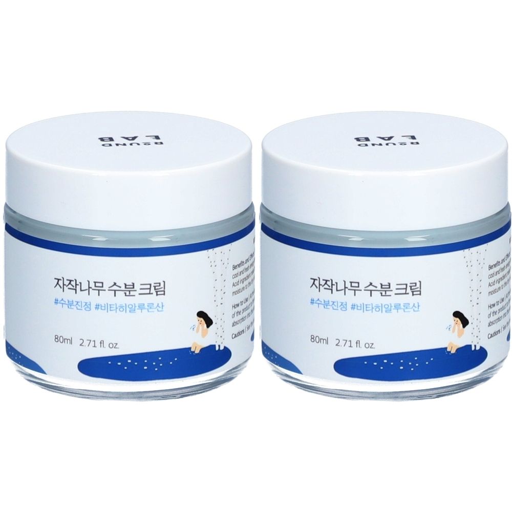 Twee ronde potten met witte deksels en blauwe rand. Koreaanse tekst op de etiketten en "80ml 2.71 fl oz".