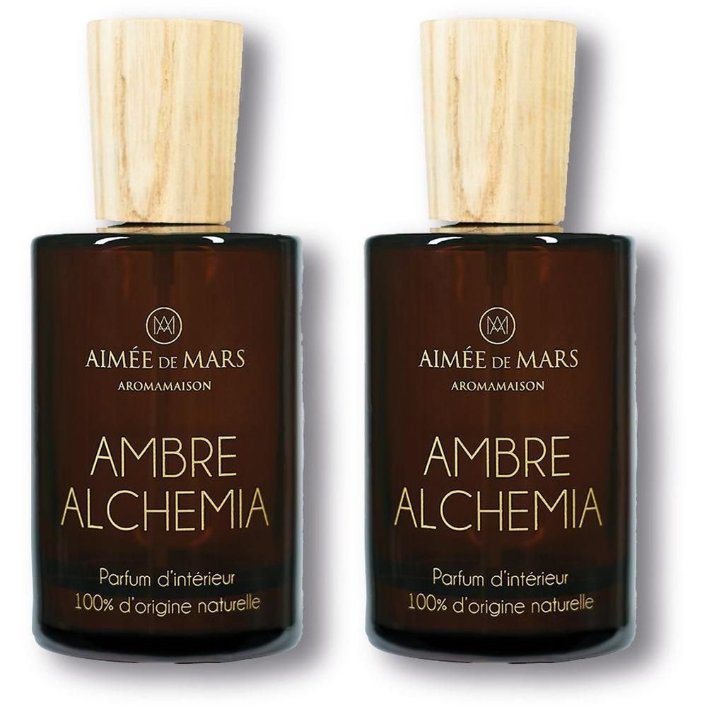 Twee flessen Ambre Albre Alchemia interieurparfum met houten dop.