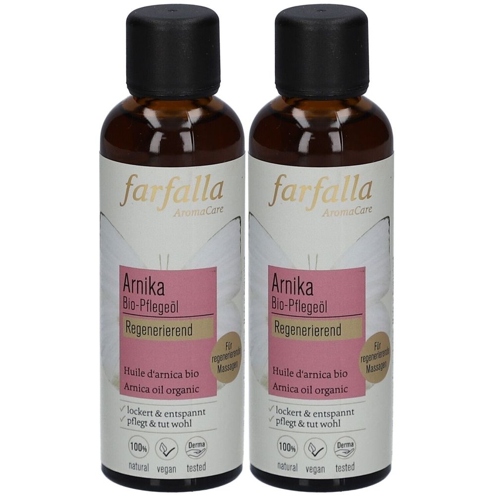 Twee flessen Farfalla Arnika Bio-Pflegeöl. Bruine glazen flessen met zwarte dop en etiket met productinformatie en logo's.
