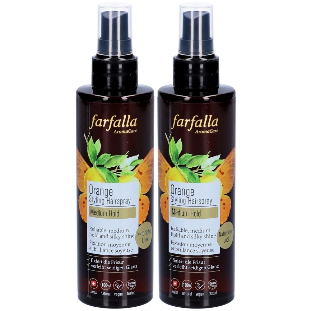 Deux flacons de Farfalla Orange Styling Hairspray. Flacons bruns avec vaporisateur noir. Inscription : Orange Styling Hairspray, Medium Hold.
