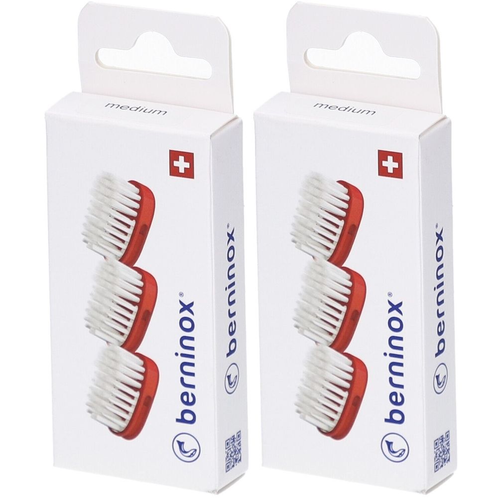 Twee verpakkingen met vervangende borstelkoppen. Elke verpakking toont drie borstelkoppen met rode houders en witte borstelharen. Merk: berninox.
