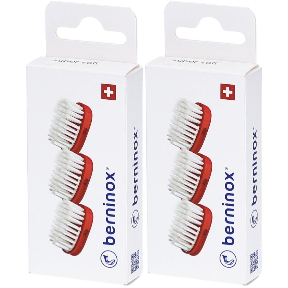 Twee verpakkingen met vervangende borstelkoppen. Rode houder, witte borstelharen. Zwitsers kruis. Opschrift: berninox.