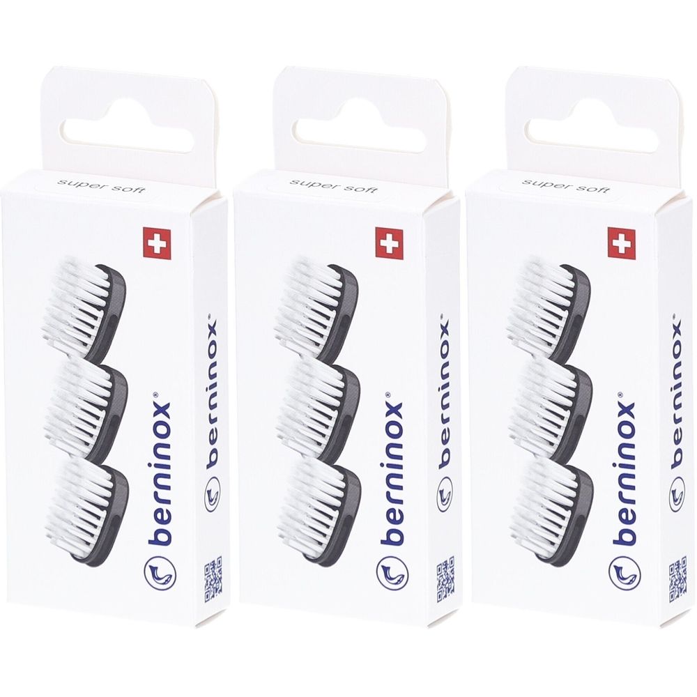 Trois boîtes de têtes de brosse de remplacement. Chaque boîte montre trois têtes de brosse avec des poils blancs et un cadre noir. Croix suisse.