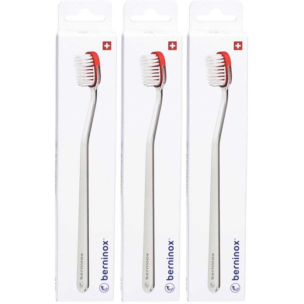 Trois brosses à dents emballées. Manche en métal, tête rouge, soies blanches. Marque: berninox. Croix suisse.