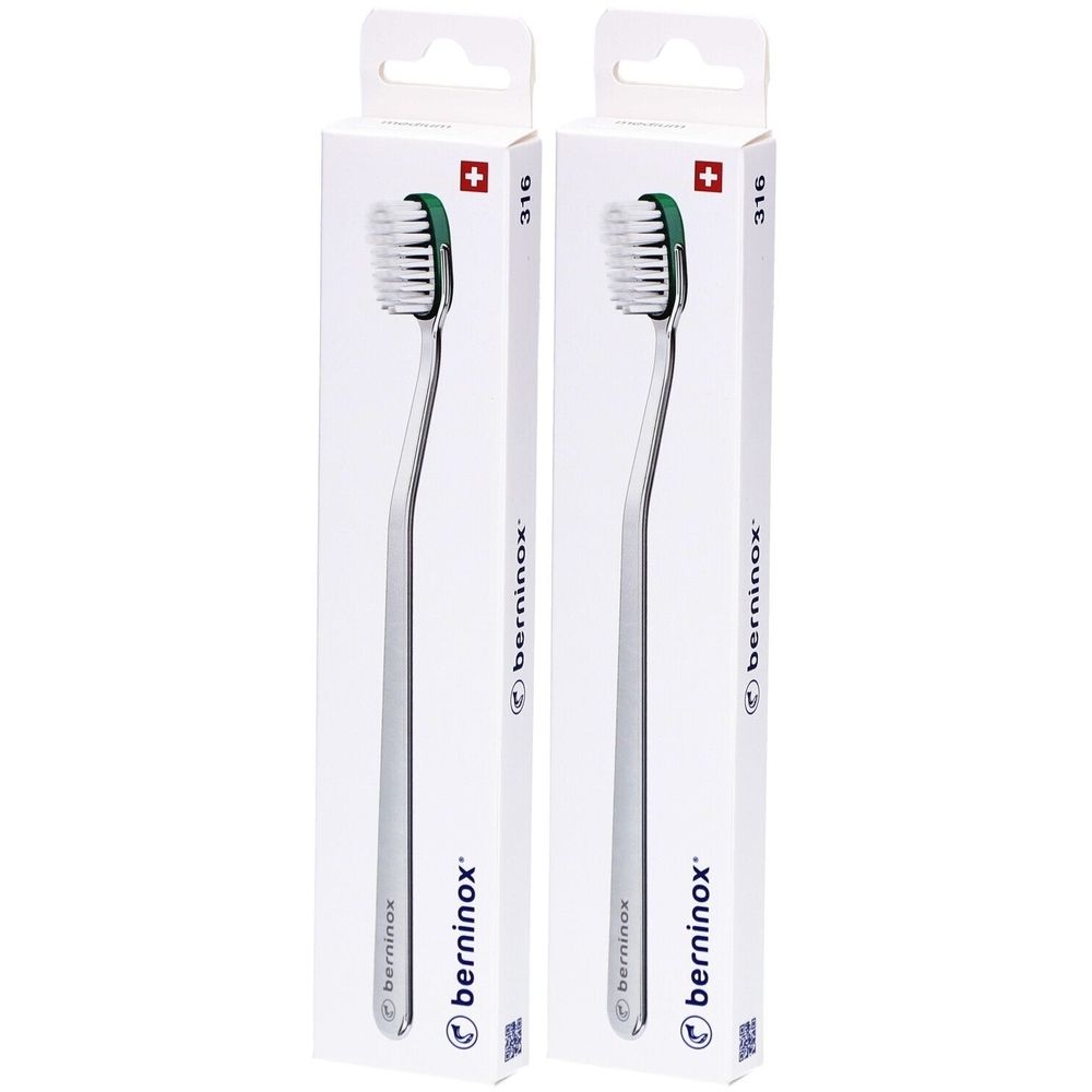Twee tandenborstels in verpakking. Metalen handvat, groene borstelkop. Merk: berninox. Opschrift: 316, Zwitsers kruis.