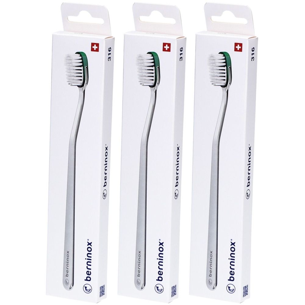 Trois brosses à dents dans des emballages blancs. Les brosses ont un manche argenté et une tête verte. Le nom "Berninox" est visible.