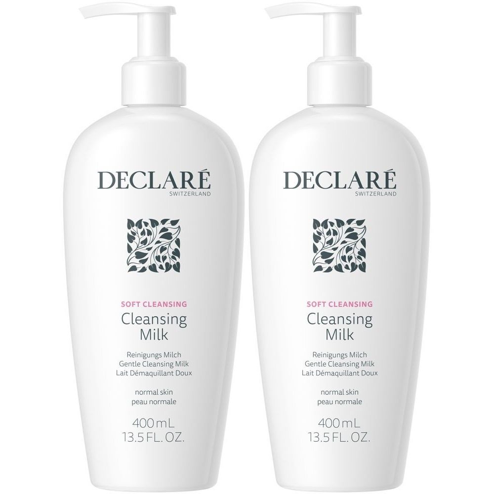 Twee witte flessen DECLARÉ Cleansing Milk met pomp. Opschrift: Cleansing Milk, 400ml. Voor normale huid.