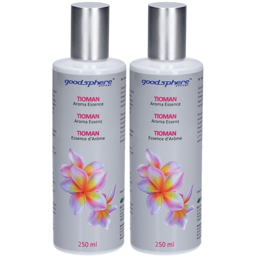 Deux flacons de TIOMAN Aroma Essence. Étiquettes grises avec motif floral et noms de produits. Bouchons argentés.