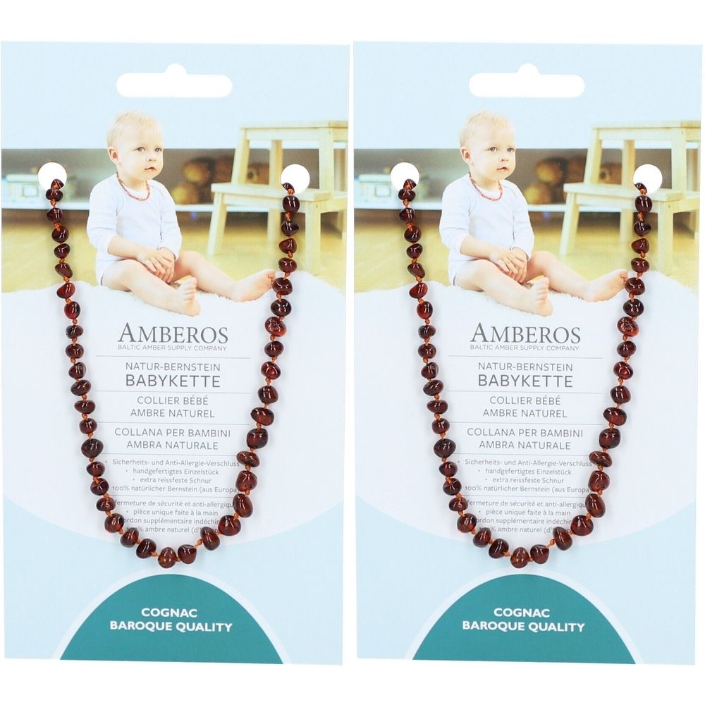 Baby barnsteen ketting, cognac kleur, barok kwaliteit. Verpakking met baby afbeelding en product informatie.