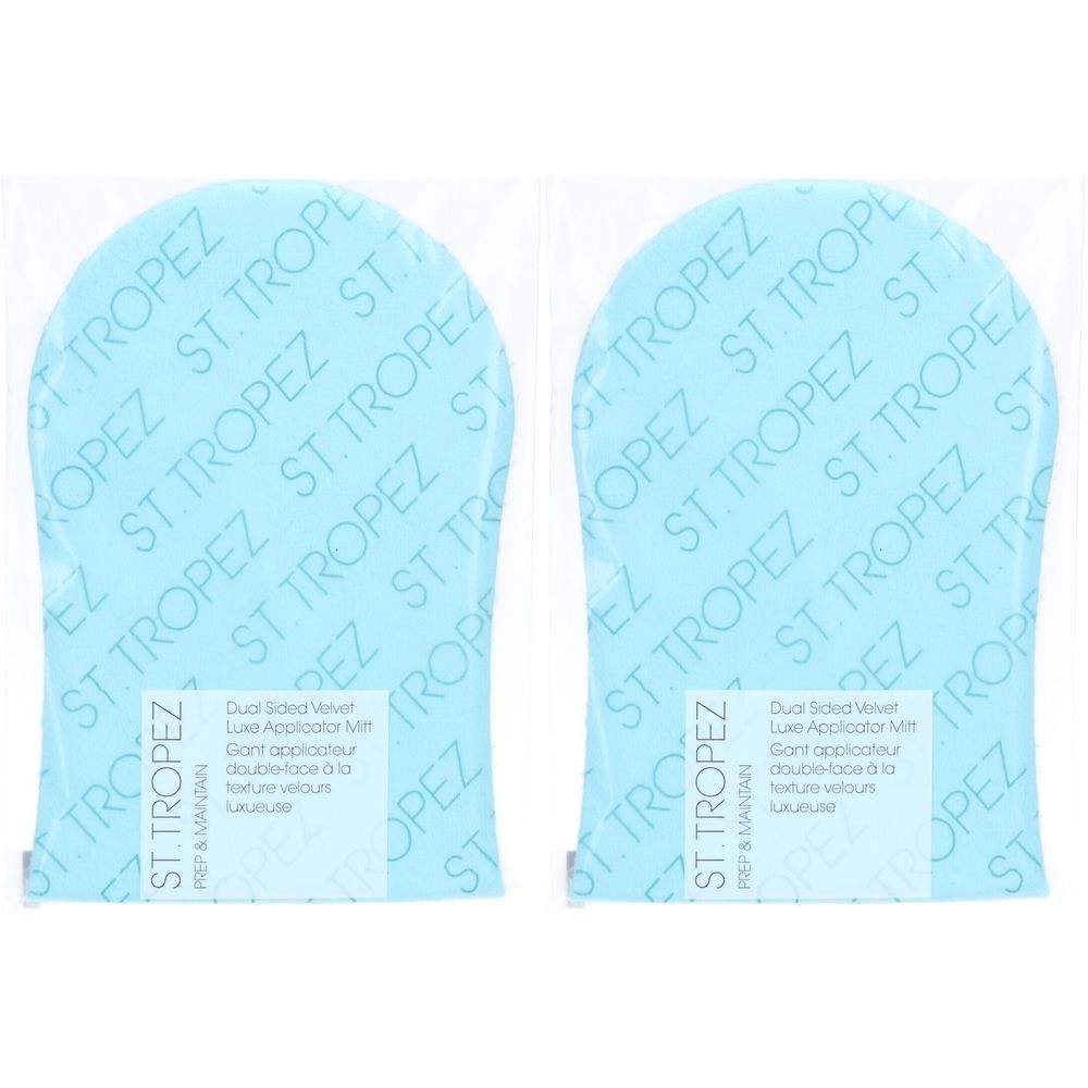 Twee blauwe applicatorhandschoenen in plastic verpakking. Opdruk: ST. TROPEZ. Tekst: Dual Sided Velvet Luxe Applicator Mitt.