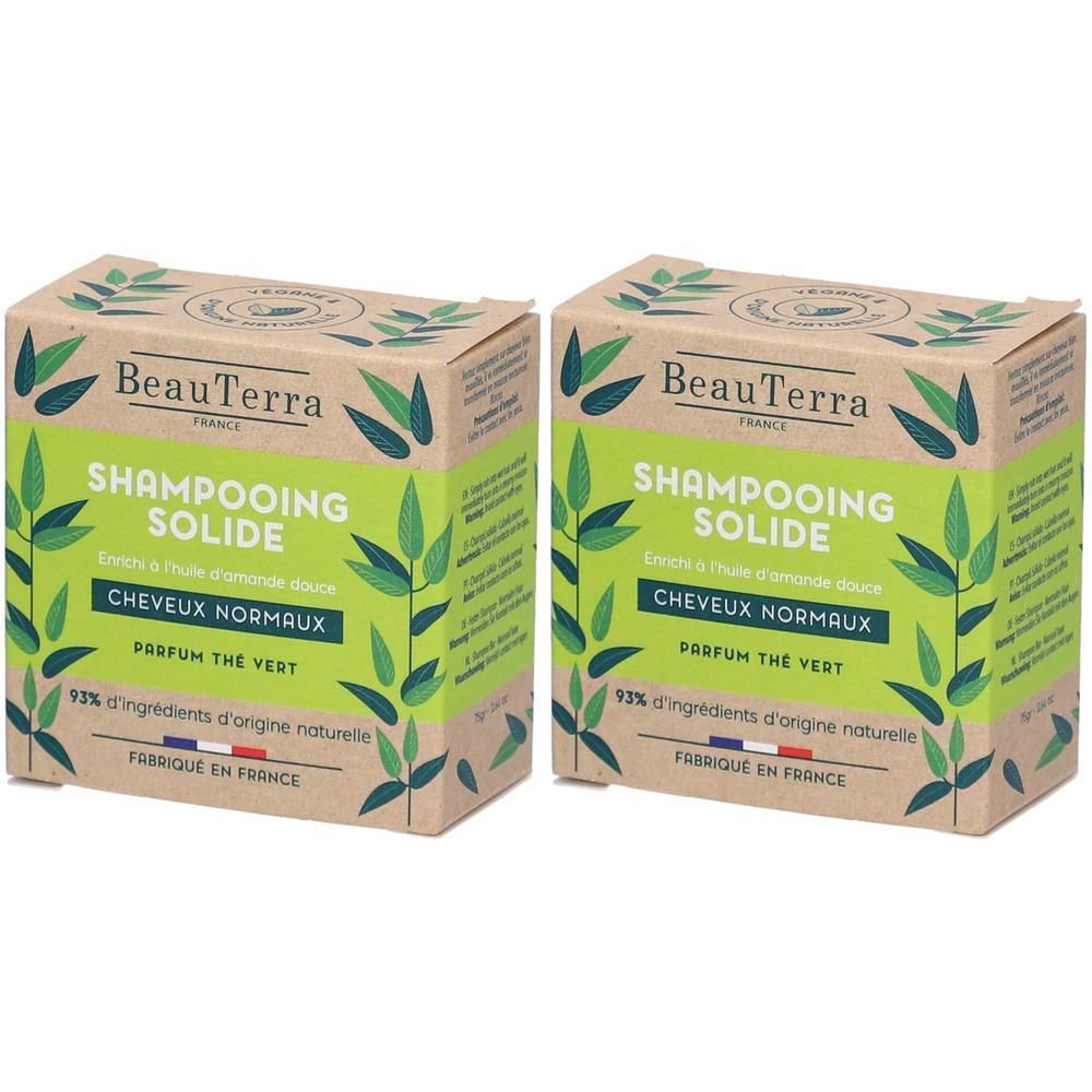 Twee dozen Shampooing Solide. Groene tekst en bladeren. Tekst: Cheveux Normaux, Parfum Thé Vert, 92% d'ingrédients d'origine naturelle.