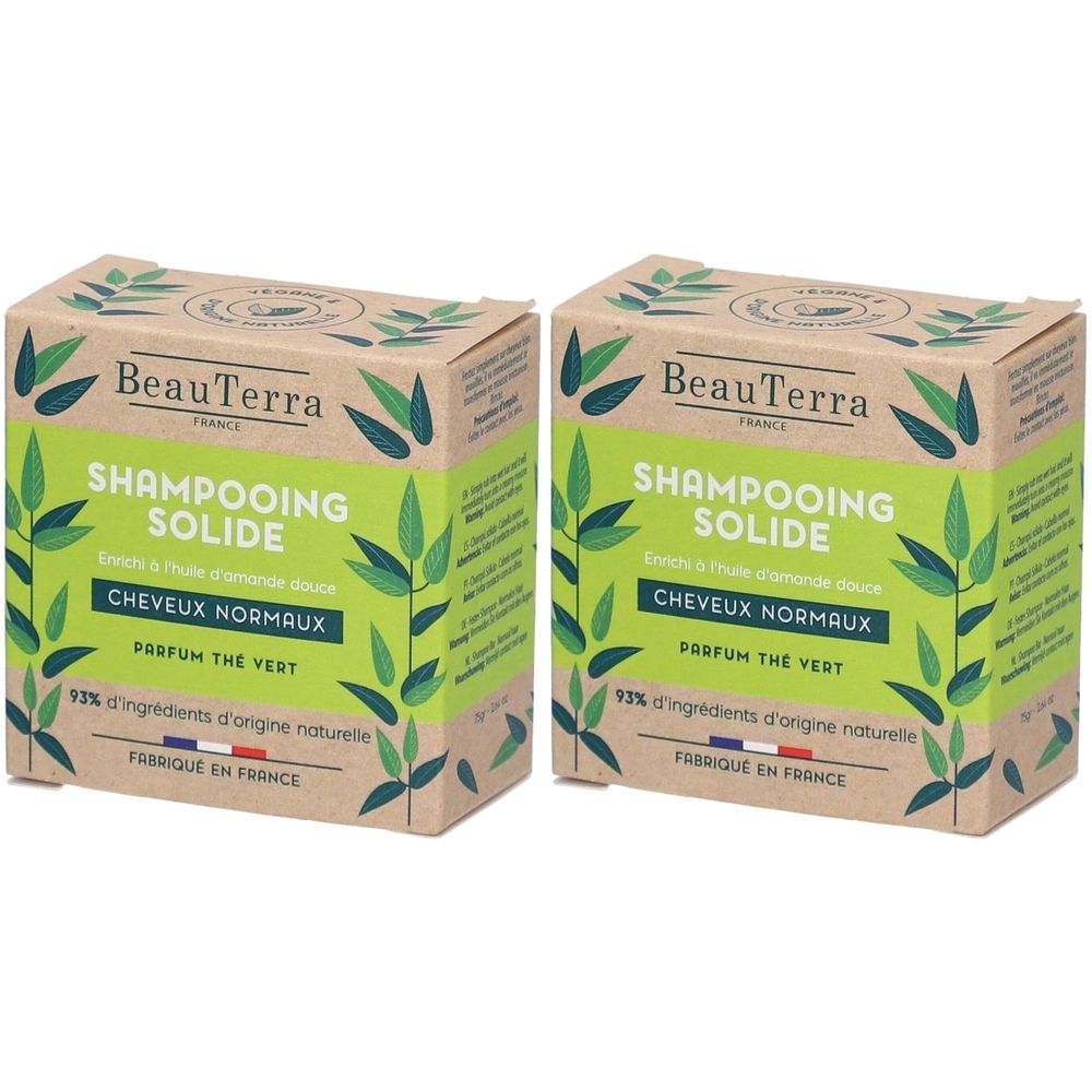 Twee dozen Shampooing Solide. Groene tekst en bladeren. Tekst: Cheveux Normaux, Parfum Thé Vert, 92% d'ingrédients d'origine naturelle.