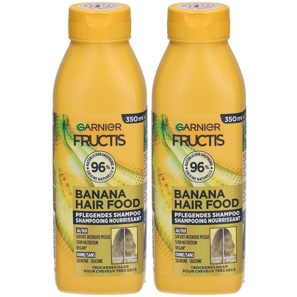 Twee gele shampoo flessen. Opschrift: GARNIER FRUCTIS, BANANA HAIR FOOD, 96% natuurlijke oorsprong. 350ml.