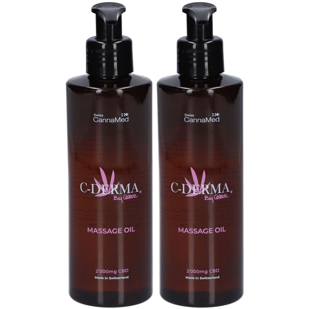 Twee bruine flessen met zwarte pomp. Opschrift: C-DERMA, Massage Oil, 2000mg CBD. Merk: CannaMed.