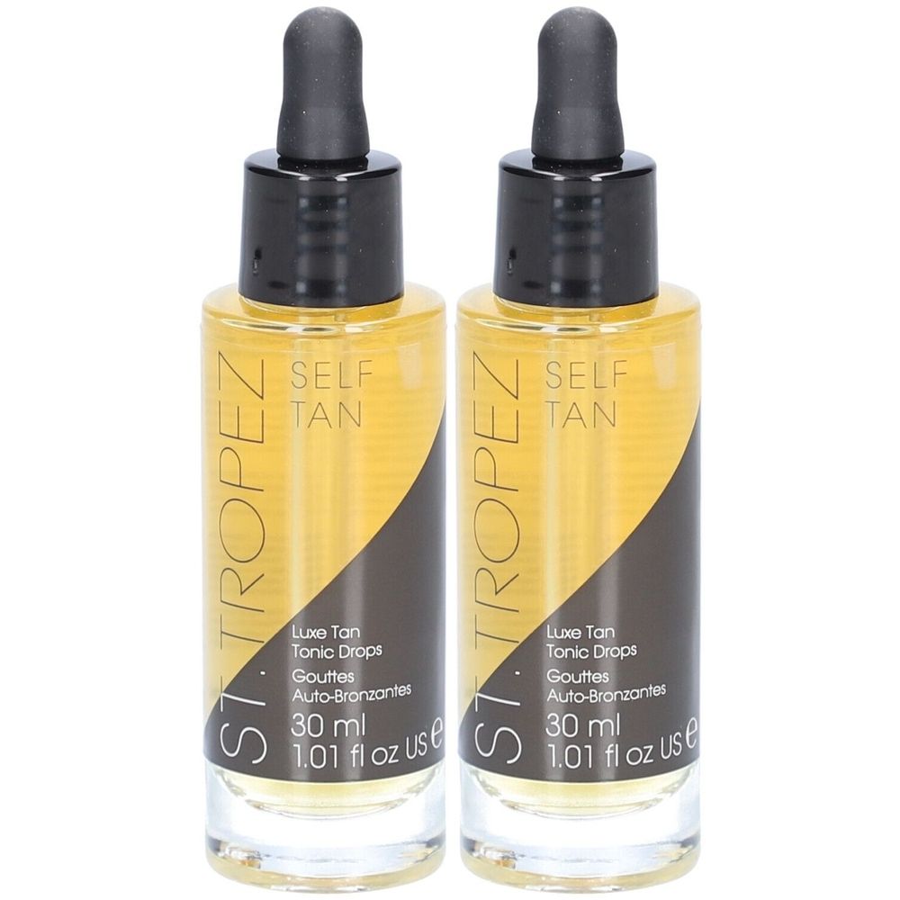 Twee flessen bruine vloeistof met zwarte dop en pipet. Opschrift: St. Tropez, Self Tan, Luxe Tan Tonic Drops.