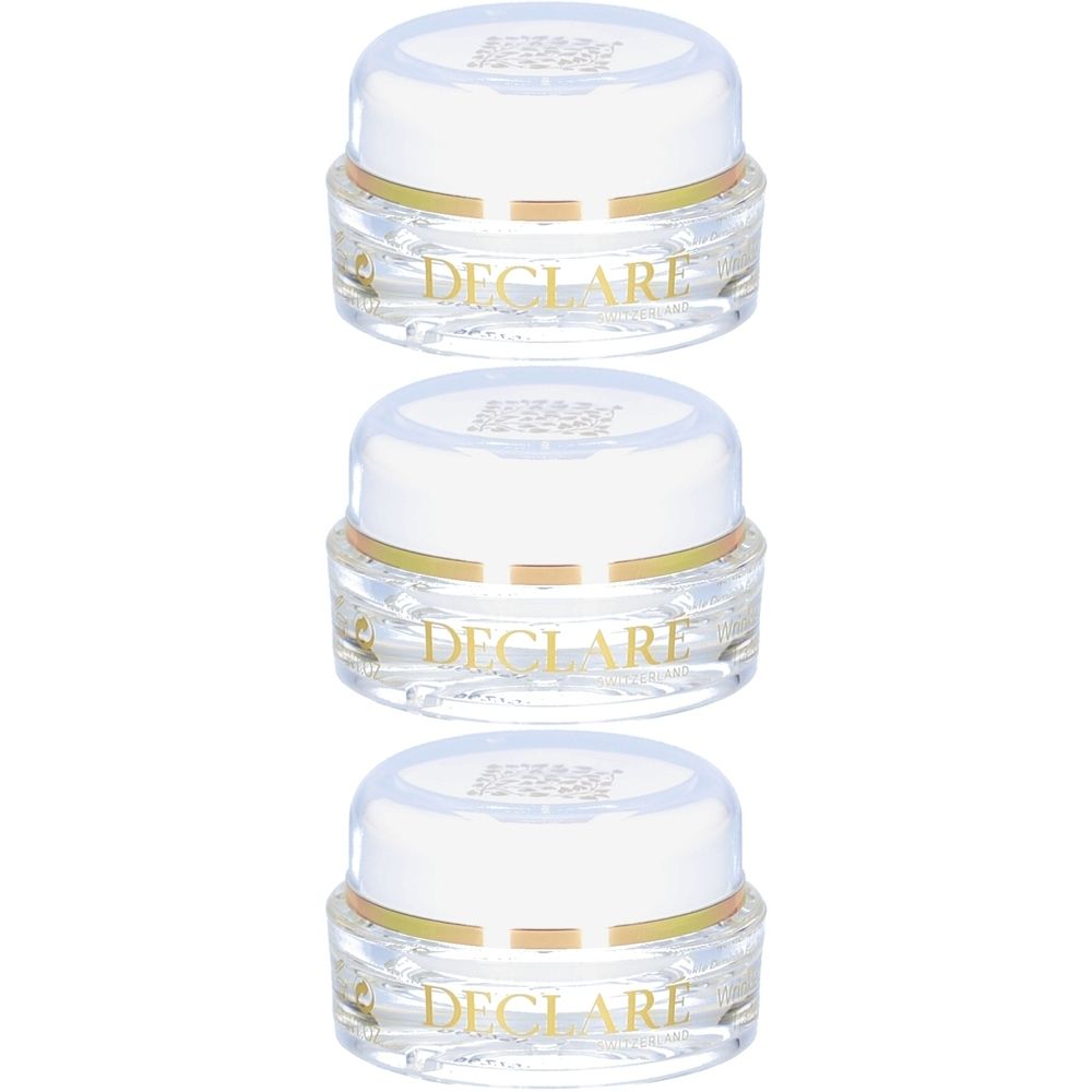 Drie kleine, transparante potjes met witte deksels. Gouden ring rond de pot. Opschrift DECLARÉ.