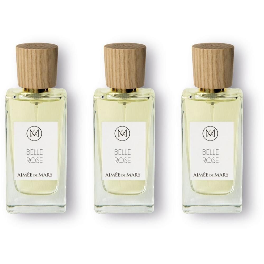 Drie glazen flacons met houten dop, gevuld met lichte parfum.