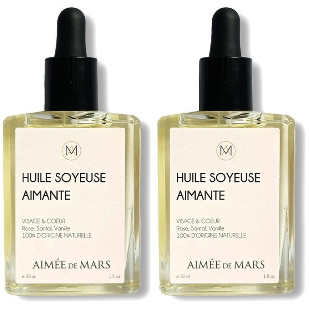 Twee flessen Aimée de Mars Loving Silky Oil met druppelsluiting. Heldere olie in rechthoekige glazen flesjes met etiket.