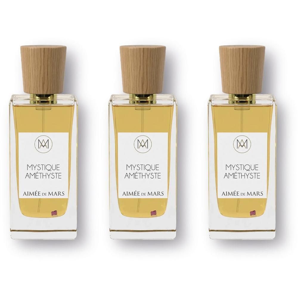 Drie flessen Aimée de Mars Mystique Améthyste Elixir met houten dopjes.