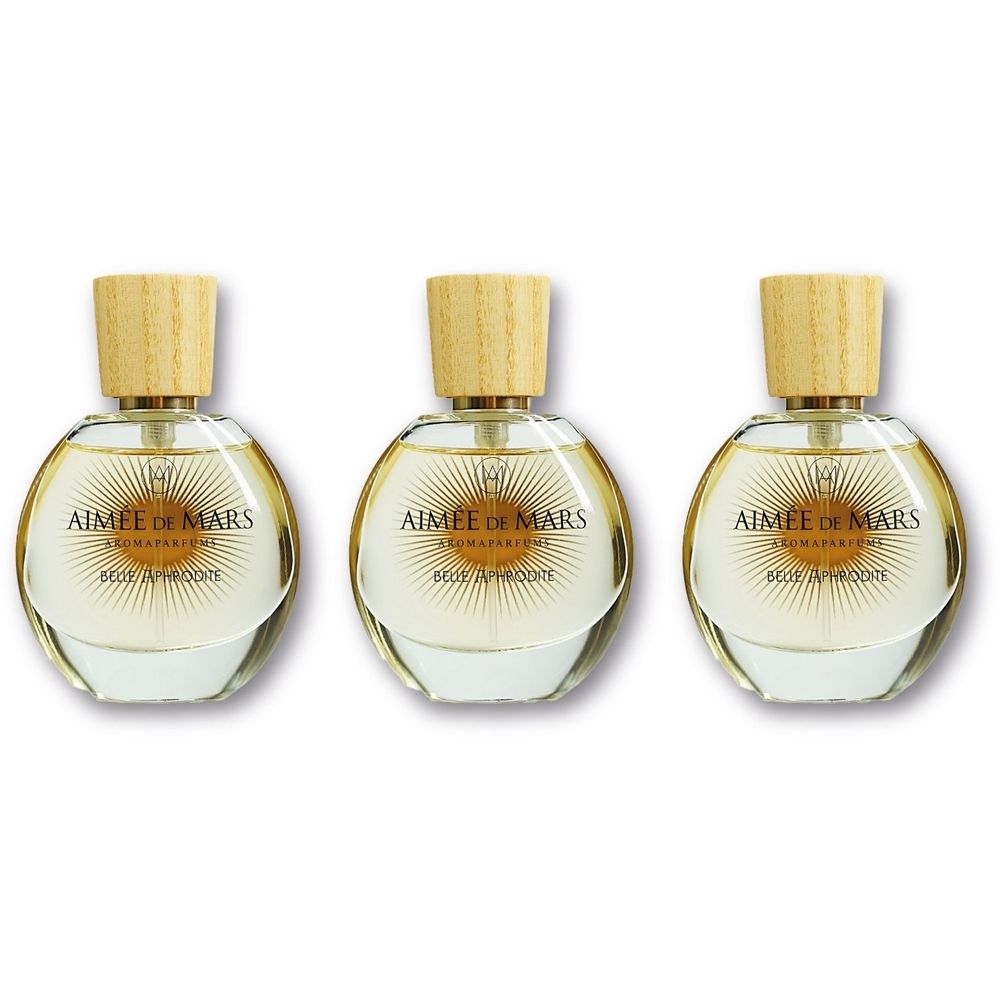 Drie ronde glazen flacons met houten dop. Opschrift: Aimée de Mars Aromaparfums. Belle Aphrodite.