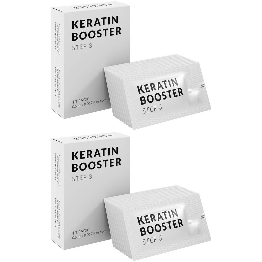 Twee witte dozen en twee zakjes met de tekst "KERATIN BOOSTER STEP 3". Op de dozen staat "10 PACK".