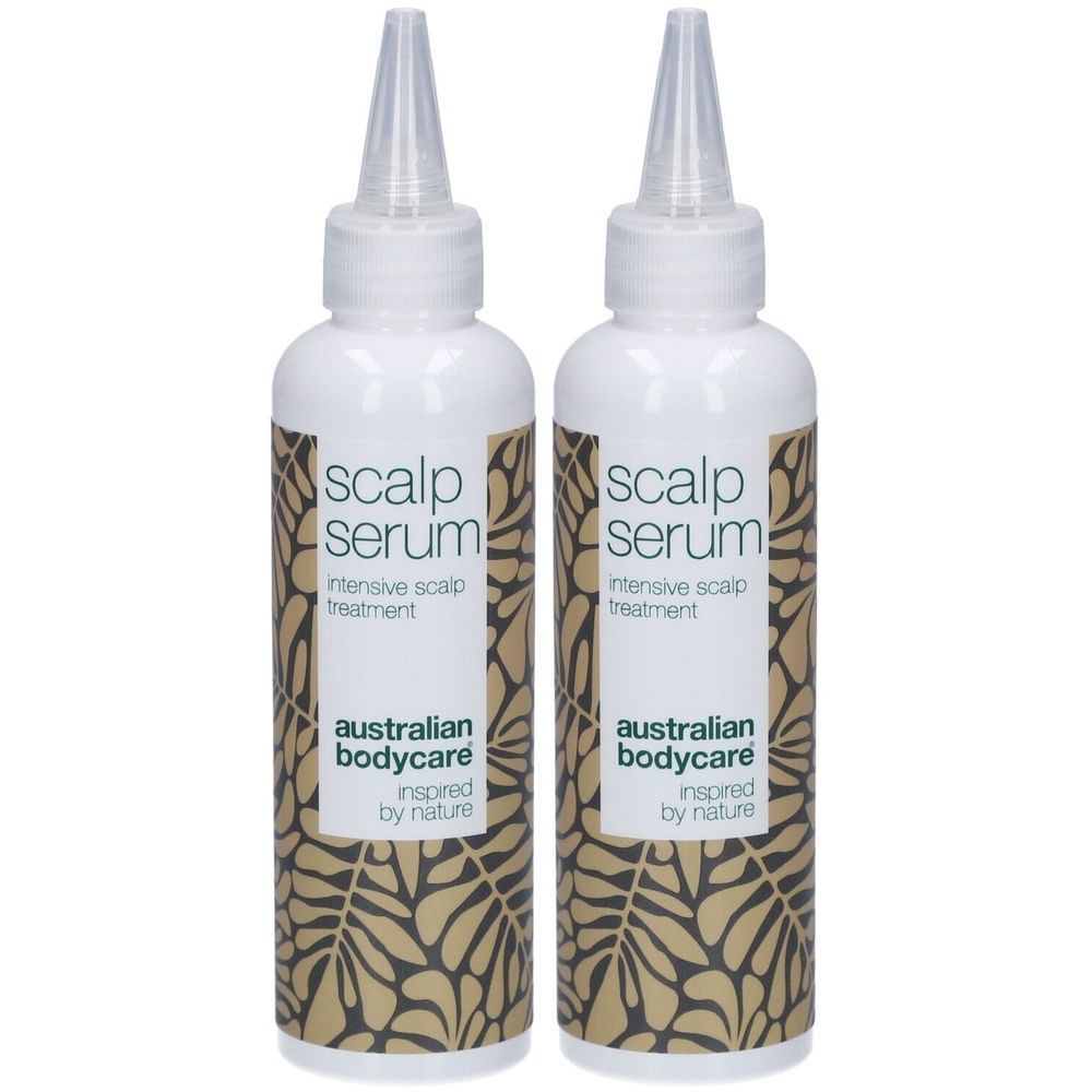 Deux flacons blancs avec applicateur. Inscription: Scalp Serum, traitement intensif du cuir chevelu, Australian Bodycare.