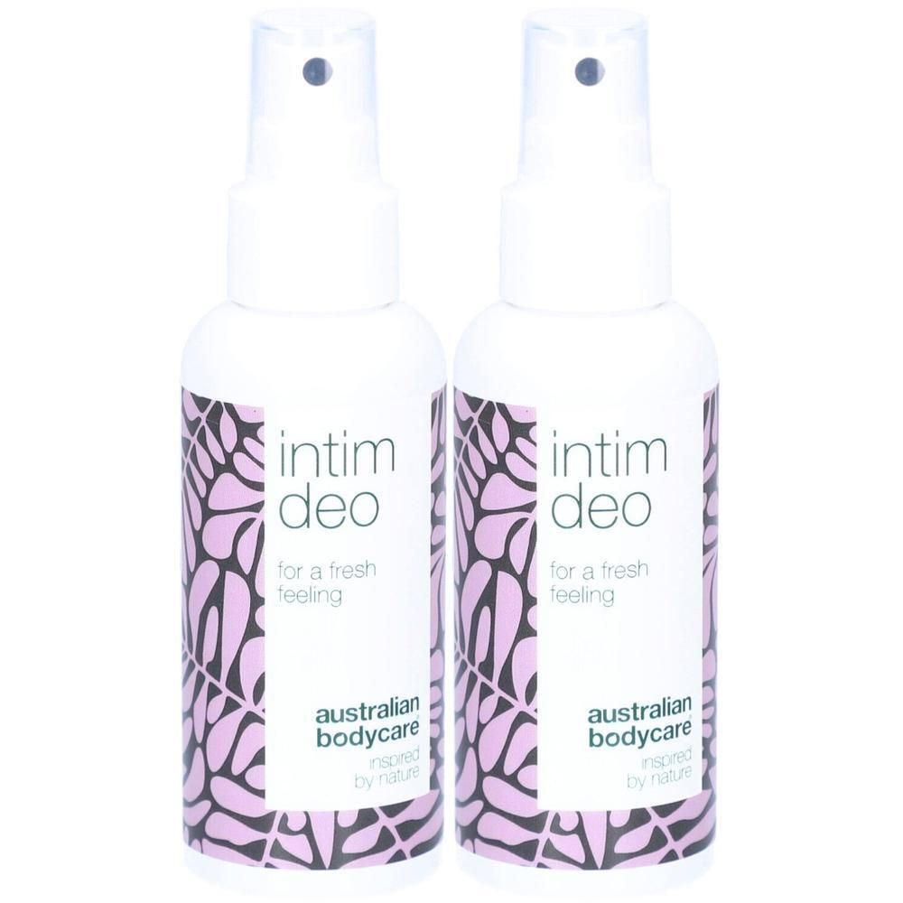 Twee witte spuitflessen met paars bloemmotief. Opschrift: intim deo, for a fresh feeling, australian bodycare.