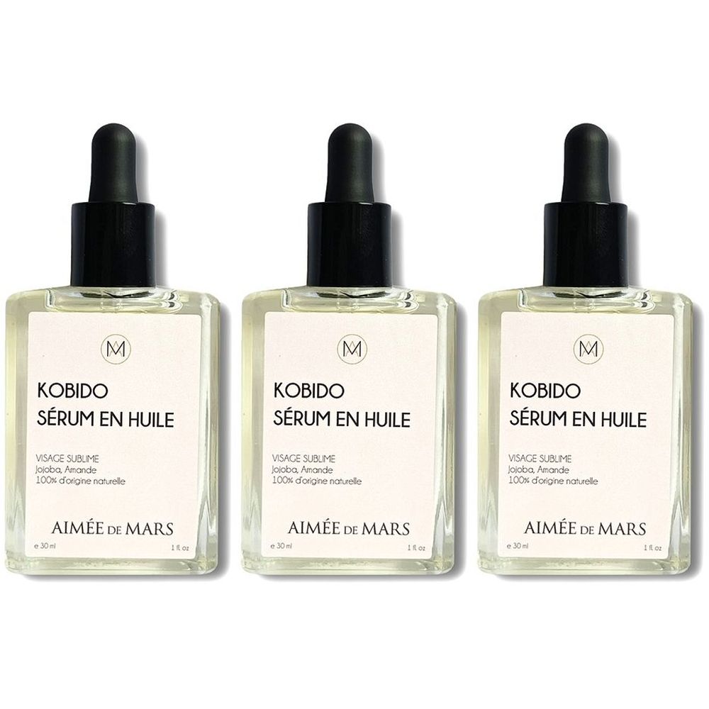 Drie flacons olie serum. Vierkante glazen flacons met zwarte dop en pipet. Opschrift: KOBIDO, SÉRUM EN HUILE, AIMÉE DE MARS.