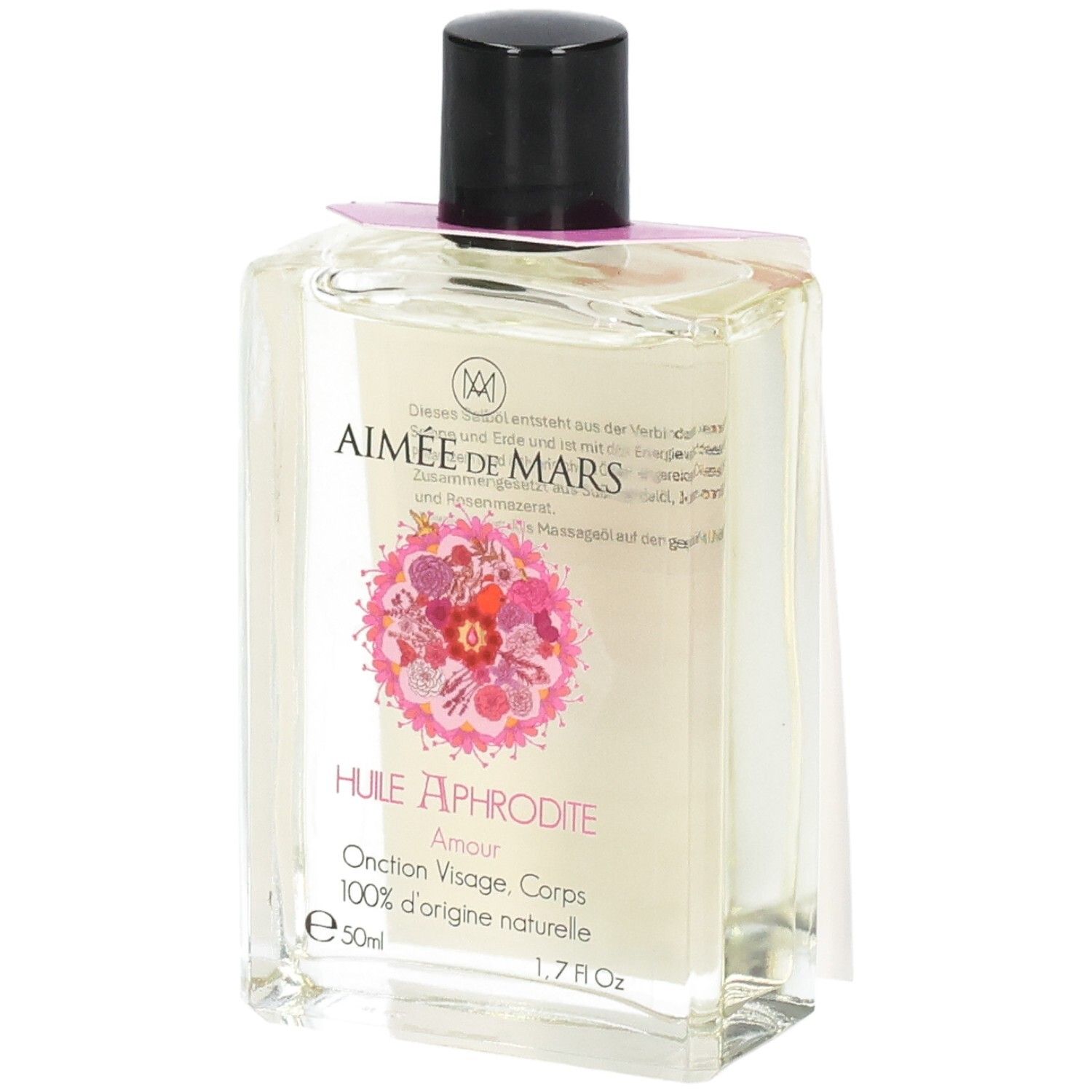 Heldere olie in een rechthoekige glazen fles met zwarte dop. Roze etiket met bloemenontwerp en tekst.