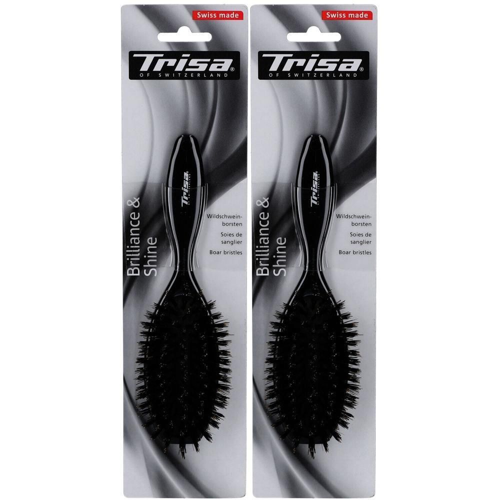 Deux brosses à cheveux en emballage. Brosses noires avec manche, marque Trisa, inscription 'Brilliance & Shine'. Fabriqué en Suisse.