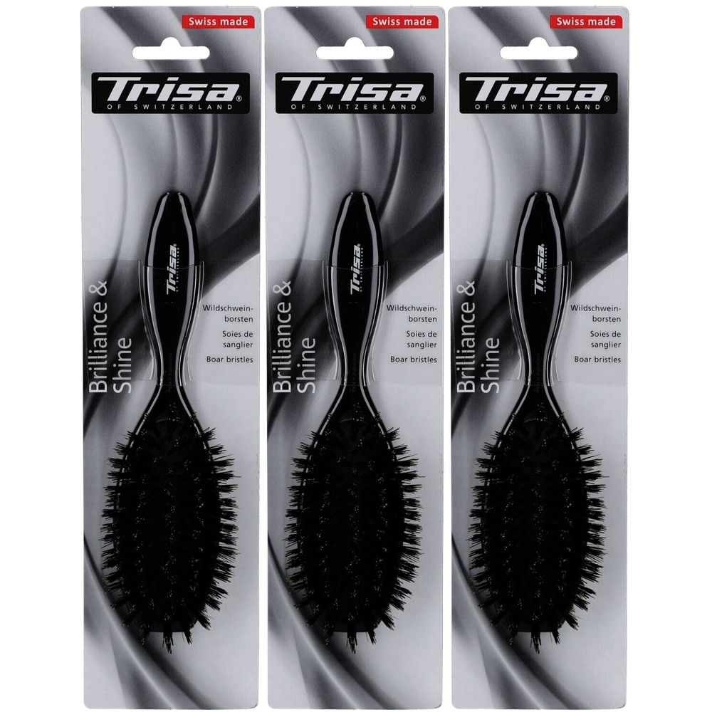 Drie zwarte haarborstels met zwijnenhaar op verpakking. Merk Trisa, opschrift Brilliance & Shine, Swiss made.