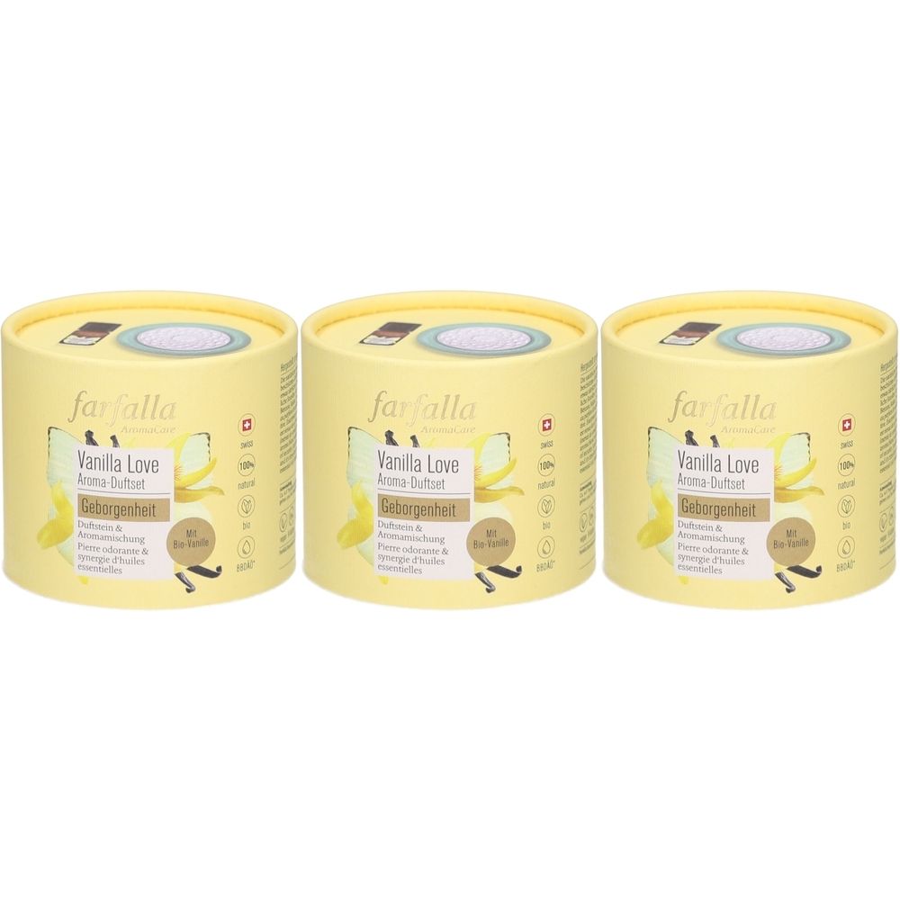 Drie cilindrische containers. Opschrift: Farfalla Vanilla Love Aroma-Duftset. Gele verpakking met productinformatie en logo.