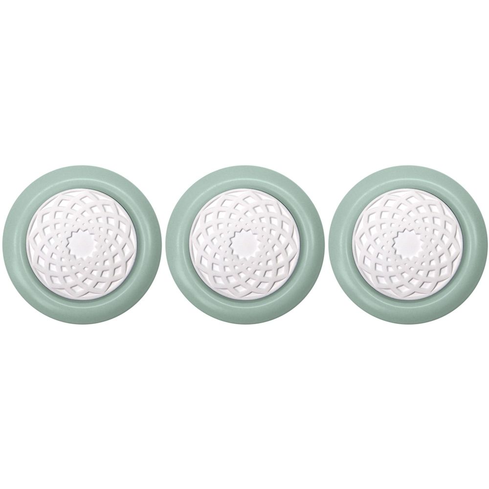 Drie ronde, lichtgroene geurstenen met een wit, bloemachtig patroon in het midden. De stenen zijn naast elkaar geplaatst.