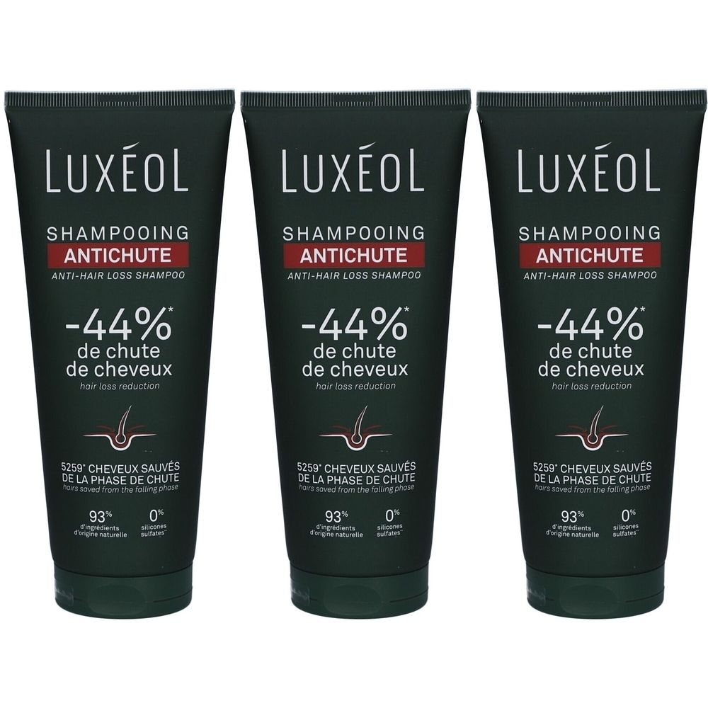 Trois tubes de shampooing LUXÉOL antichute. Tubes noirs avec texte blanc et accent rouge. -44% de chute de cheveux.