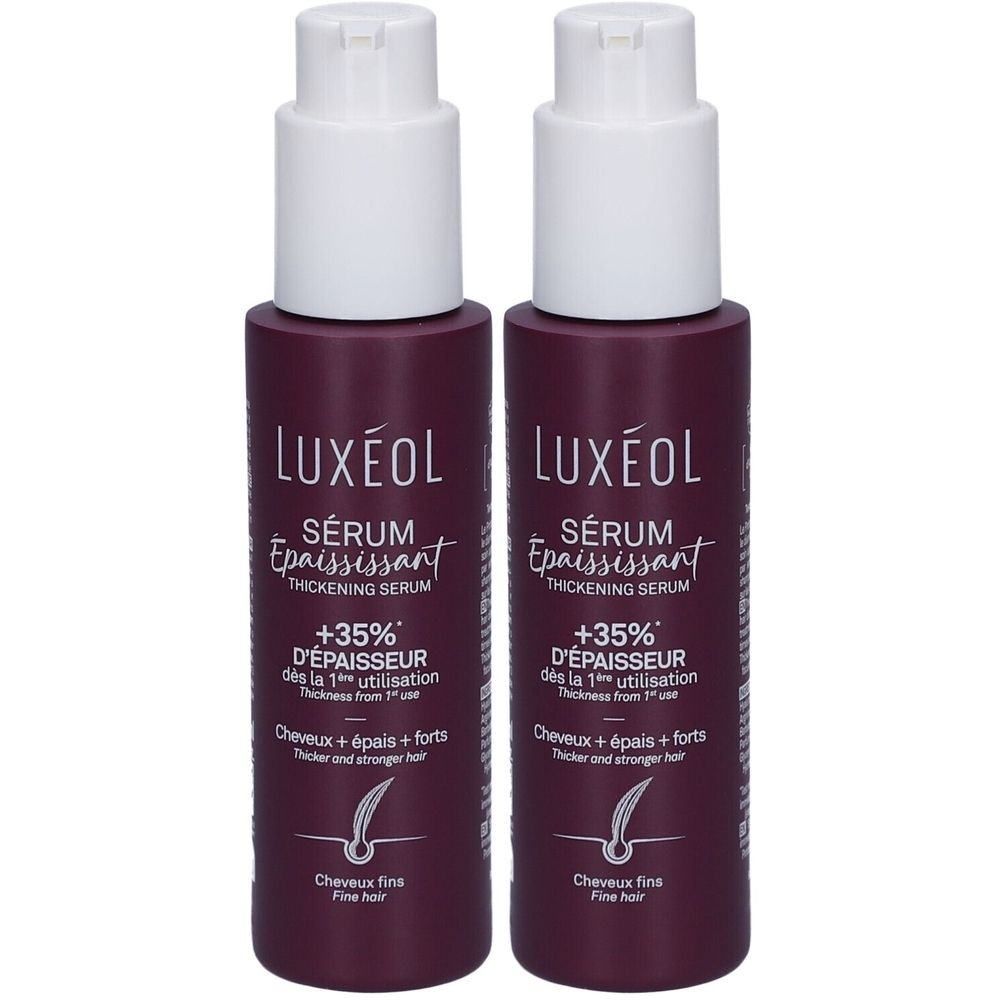 Twee flessen LUXÉOL serum. Donkerpaarse flessen met witte pompkop. Tekst: Serum, +35% meer volume, voor fijn haar.