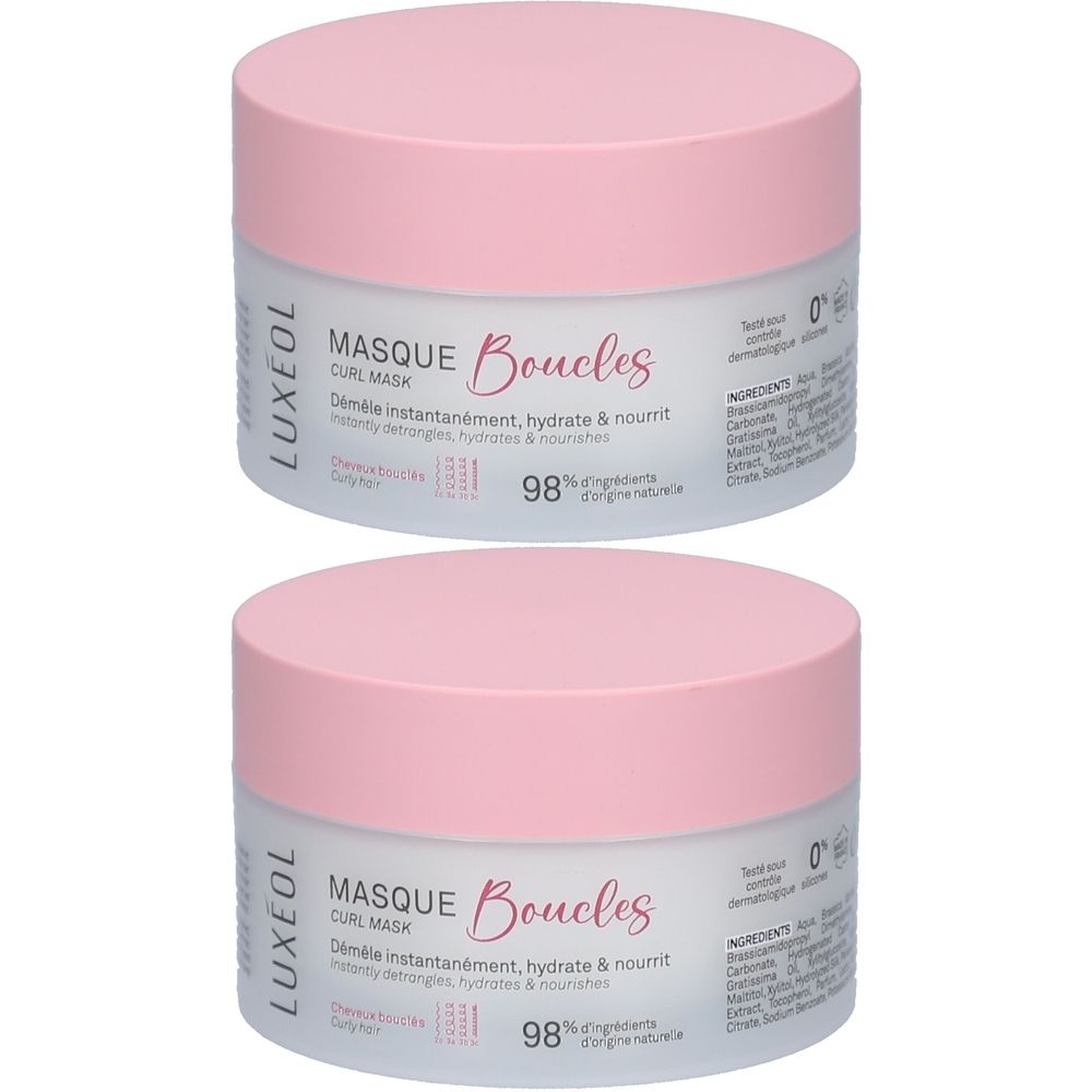 Deux pots ronds avec couvercles roses. Inscription: LUXÉOL, Masque Boucles. Texte: Démêle, hydrate & nourrit. 98% d'ingrédients d'origine naturelle.